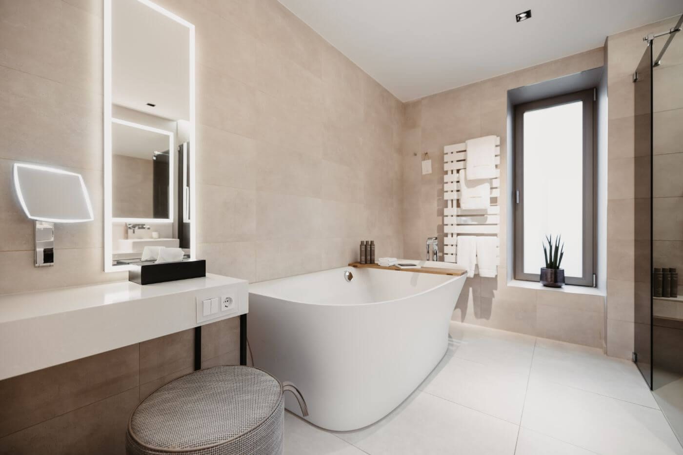 Large bathroom with bathtub, heated towel rail and dressing table with illuminated mirror