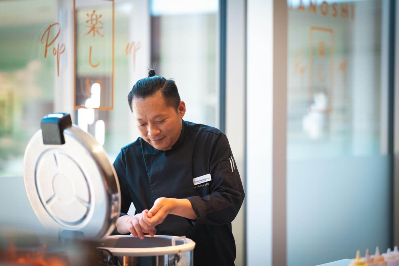 chef forming rice from the rice cooker in a sushi restaurant in Donaueschingen