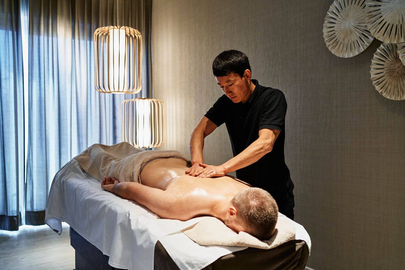 man getting a massage in a elegant wellness area